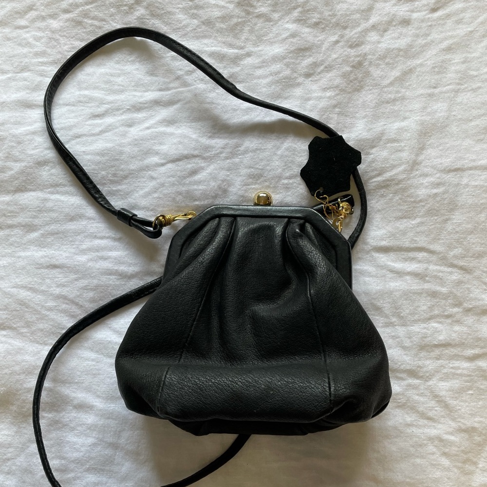 Wilsons purse . Very rare, unique,  black vintage with gold colored hardware.